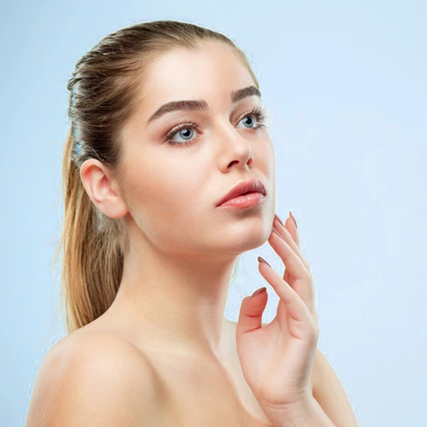 Young woman with clear skin after a skin booster treatment.